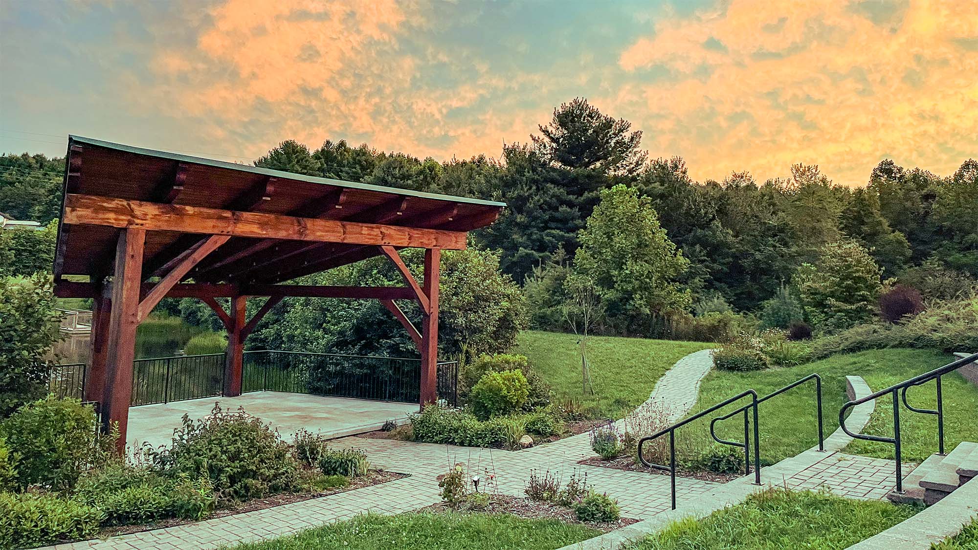 The Event Center pavilion and garden overlook the pond